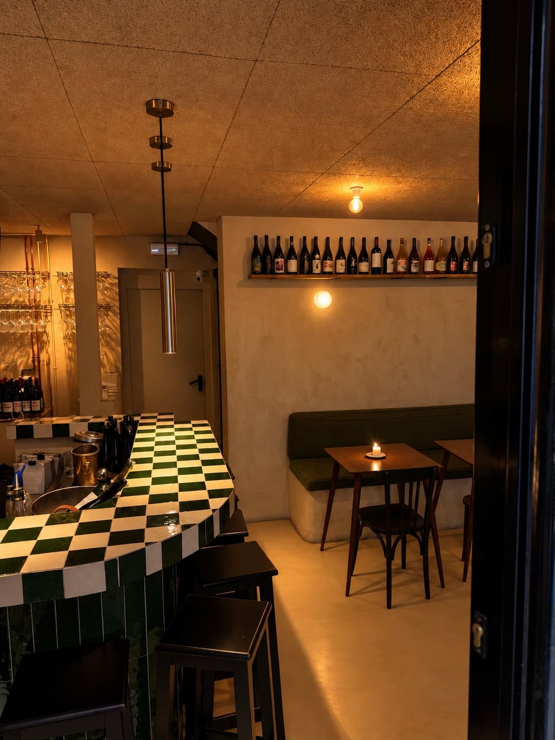 The entrance and green tiled bar at Casa Botella