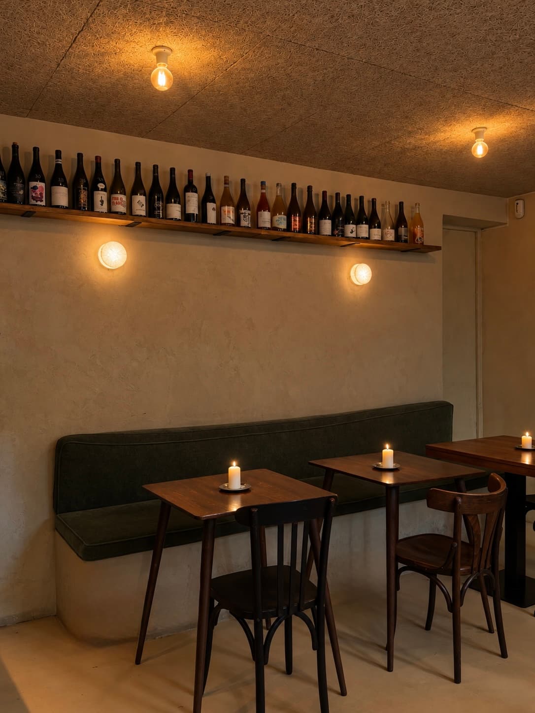 The dining room and bottle shelves at Casa Botella